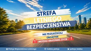 Budynki i droga oraz napis strefa letniego bezpieczeństwa nie przejeżdżaj obojętnie możesz uratować komuś życie.