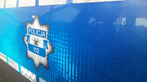 część napisu z radiowozu, gwiazda policyjna i nr telefonu 112
